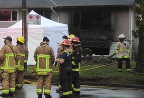 Firefighters on the scene in a house on 41st Avenue on Earles Street Sunday morning. Three people died and two were taken to hospital.