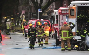 Firefighters on the scene in a house on 41st Avenue on Earles Street Sunday morning. Three people died and two were taken to hospital.