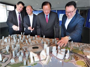 In this file photo from June, 2017, Canadian Metropolitan Properties Corp. owner Oei Hong Leong (second from right) stands with (from left) Kevin Hoffman, Daisen Gee-Wing and James Cheng to unveil the revamped design for a redevelopment of the Plaza of Nations site.