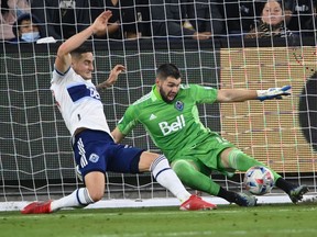 Nov 2, 2021; Los Angeles, California, USA; Vancouver Whitecaps goalkeeper Maxime Crepeau (16) and defender Jake Nerwinski (28) make a save in the second half against the Los Angeles FC at Banc of California Stadium. Reports broke Wednesday night that Crepeau had been traded to LAFC.