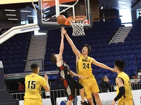 Burnaby South Rebels' star Sasha Vujisic rises up to block a shot against Mount Baker during Wednesday's action at the B.C. high school boys basketball championships at Langley Events Centre.