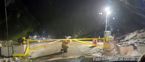 A surveillance camera captures an attacker lighting off a flare during the attack on the Coastal GasLink camp near Houston, B.C, on Feb. 17. This image, taken as the attack started, was provided by the company. The attackers disabled the cameras a short time later.