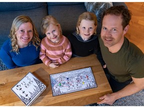 The MacDonald family seen here, from left, Josie, Casey, Rio and Scott, enjoy playing Lifts and Runs the board game nine-year-old Rio invented when he was six. Now out in the world and for sale online and at various retailers, the game has players skiing down a collection of Rio's favourite ski runs and riding chairlifts and gondolas on both Whistler and Blackcomb mountains.