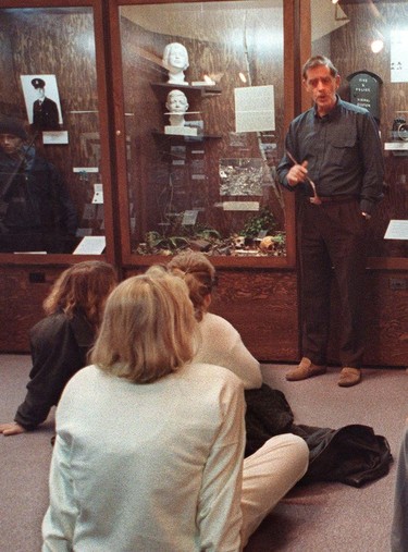 Joe Swan, past curator of the Police museum gives a tour of the museum, in the background to his right is a display of the 'Babes in the Woods' an unsolved murder in Stanley Park.