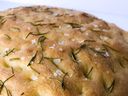 Focaccia is an Italian yeast bread with a low profile, similar to a pan bread, but with a distinctive, dimpled appearance. 