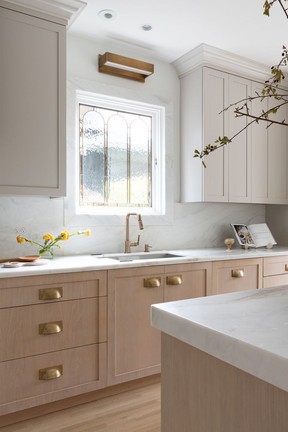 A stained glass window over the kitchen sink.