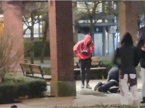 Image from a VPD video of a violent swarming and beating in Yaletown on Feb. 20.