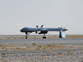 A U.S. Predator unmanned drone armed with a missile sits on the tarmac of Kandahar military airport in Afghanistan.