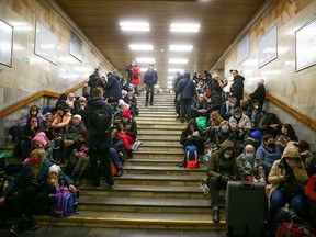 Kyiv civilians take shelter in a subway station on Thursday soon after explosions began erupting throughout the Ukrainian capital as a result of preliminary air attacks by the Russian Federation.