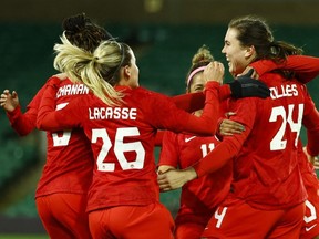 Canada's Vanessa Gilles (No. 24) celebrates scoring a goal with teammates against Germany at the Arnold Clark Cup in Norwich, England on Feb. 20, 2022.