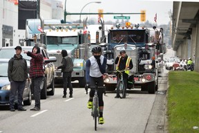 Counter-protesters block a convoy as truckers and supporters continue to protest coronavirus disease (COVID-19) vaccination mandates, in Vancouver, British Columbia, Canada February 5, 2022.