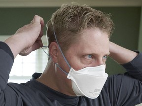 B.C. must supply information for people to make their own decisions on COVID precautions once government orders are eased, such as wearing N95 masks like this one in public, an expert says.
