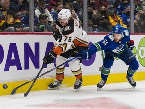 Vancouver Canucks forward Tyler Motte stick checks Anaheim Ducks defenceman Josh Mahura in the first period at Rogers Arena Feb. 19. 2022.