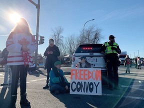Drumming, dance music and flags filled the air at the corner of 176th Street and 8th Avenue, where RCMP had set up a blockade preventing vehicles from making their way toward the border crossing.
