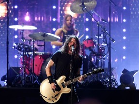 Dave Grohl and Taylor Hawkins of the Foo Fighters perform after the band was inducted into the Rock and Roll Hall of Fame, in Cleveland, Ohio, U.S. Oct. 30, 2021.