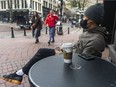 FILE PHOTO: A Starbucks customer drinks from a disposable cup.