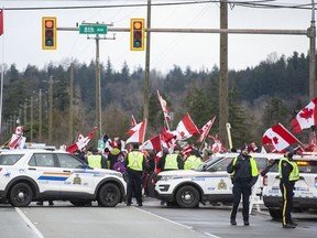 Hundreds of people protest mask and vaccine mandates at 176 Street and 8 Avenue in Surrey, BC on Feb. 19, 2022.