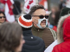 Hundreds of people protest mask and vaccine mandates at 176th and 8th Avenue in Surrey, BC Saturday, February 19, 2022. The Pacific Highway border crossing was closed by police due to the size of the protest.