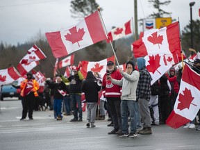 People protest mask and vaccine mandates at 176th and 8th Avenue in Surrey on Saturday, February 19, 2022. The Pacific Highway border crossing was closed by police for awhile due to the size of the protest.
