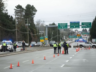 Hundreds of people protest mask and vaccine mandates at 176th and 8th Avenue in Surrey, BC Saturday, February 19, 2022. The Pacific Highway border crossing was closed by police due to the size of the protest.