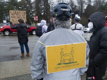 Anti vaccine mandate protesters, marshalling for a 'freedom rally', are met by an equal number of counter protestors at E. Hastings and Renfrew Streets Saturday morning, February 19, 2022. The police eventually stepped in to keep the groups separate as the convoy left.