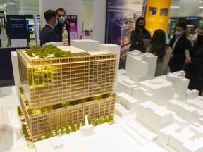 The Hudson's Bay building in downtown Vancouver may be redeveloped with a 12 storey addition on to Pictured is an architectural mock-up of the future building on display at the HBC downtown store Wednesday, February 23, 2022.