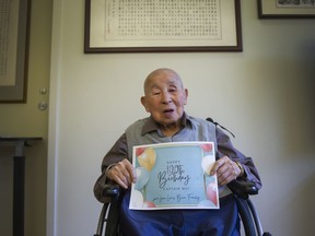 Ting Cheng Wu will turn 100 years old Feb. 22.  He did the Chinese calligraphy on the wall.
