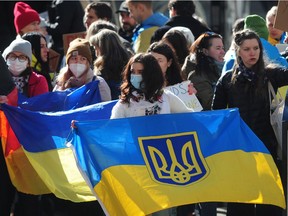 Demonstrators attend a Stand with Ukraine Against Russian Invasion rally at the Vancouver Art Gallery in Vancouver,  BC., on February 24, 2022.