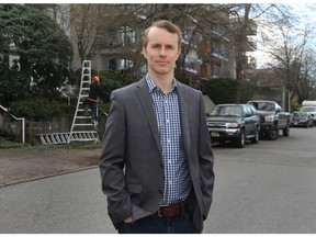 Alex Hemingway, a senior economist with the Canadian Centre for Policy Alternatives in action in a residential area in Vancouver BC., December 8, 2021.