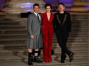 (L-R) US actor Oscar Isaac, Egyptian actor May Calamawy and US actor Ethan Hawke pose on arrival to attend the Special Screening of Marvel Studios' Moon Knight at the British Museum, in London on March 17, 2022.