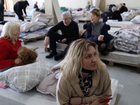 Almost three million Ukrainians have fled Ukraine this year in the first three weeks of Russia's invasion. Ukrainian Jewish refugees wait inside a hangar in the Moldovan capital Chisinau on March 15, 2022, before heading to the airport to board a plane to Israel. .