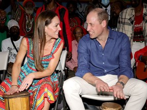 Prince William, Duke of Cambridge and Catherine, Duchess of Cambridge play the drums during a visit to Trench Town Culture Yard Museum where Bob Marley used to live, on day four of the Platinum Jubilee Royal Tour of the Caribbean on March 22, 2022 in Kingston, Jamaica.