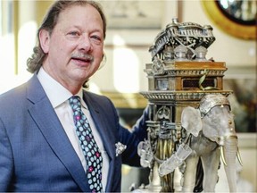 Peter Boyle, owner of Lund's Auction House, with a Baccarat crystal and gilt elephant dating to the late 1800s, once owned by American industrialist George Westinghouse.