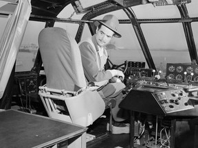 Howard Hughes makes preparations in the cockpit of the Spruce Goose. The Spruce Goose was the largest wooden airplane ever built, and had its only flight on Nov. 2, 1947.