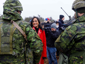 Minister of Defence Anita Anand during a March 8 visit to Canadian soldiers serving in Latvia. Soon after her return, Anand announced she would be introducing "aggressive" proposals to boost Canadian defence spending in the next federal budget.