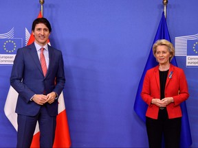 Prime Minister Justin Trudeau and European Commission President Ursula von der Leyen pose before a meeting after a meeting at the EU headquarters in Brussels, on March 23, 2022.