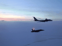 Canadian and American jets intercept a Russian Tu-142 maritime reconnaissance aircraft in 2020. 