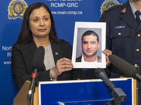 RCMP Det. Cpl. Sukhi Dhesi of the Integrated Homicide Investigation Team holds up a photo of Milad Rahimi, 34. Rahimi, who had gang links, was the victim of a brazen public shooting in a supermarket parking lot in North Vancouver on Friday, March 11, 2022.