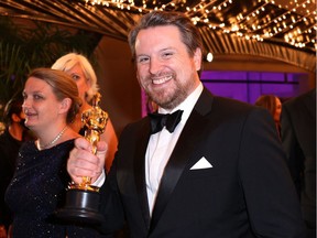 Tristan Myles with the Oscar for Best Visual Effects for Dune at the Governors Ball following the 94th Academy Awards in Los Angeles on March 27, 2022. REUTERS/Mike Blake