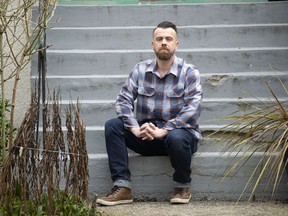 Justin Grant, pictured in Vancouver on Feb. 17, 2022, says he was fired from his job at Independent Grocers for helping homeless people in the area. The store has filed a response to Grant's lawsuit claiming that there was just cause for the termination.