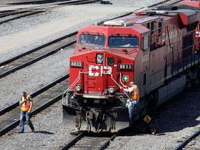 A Canadian Pacific Railway crew works on their train at the CP Rail yards in Calgary.
