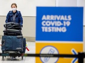 A sign for COVID-19 testing at Toronto's Pearson airport.