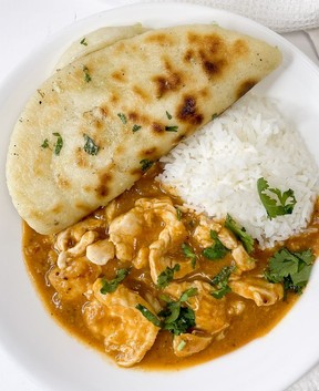Indian coconut chicken curry and basmati rice with garlic naan.