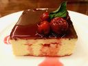 Cottage cheese cake. or Lviv syrnyk, at Kozak: Think cheesecake but denser, a little drier. Topped with chocolate glaze and a stewed cherries garnish.