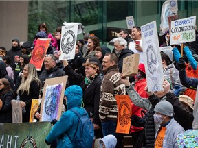 Members of the Nuchatlaht First Nation and supporters rally outside B.C. Supreme Court before the start of an Indigenous land title case, in Vancouver, on Monday, March 21, 2022.