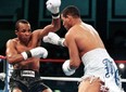 Hector "Macho" Camacho hammers Sugar Ray Leonard in a 1997 title bout.