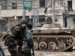 Syrian pro-government forces patrol Aleppo streets in 2016. Eleven years of civil war in Syria has produced a generation of men with fighting experience but few employment options.
