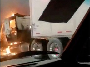 A truck is seen set ablaze in the Mexican border city of Nuevo Laredo following the arrest of the gang leader Juan Gerardo Trevino, also known as, "El Huevo", in Nuevo Laredo, Mexico, in this screen grab taken from a video obtained from social media March 14, 2022. @HIRAM_AR/via REUTERS THIS IMAGE HAS BEEN SUPPLIED BY A THIRD PARTY. MANDATORY CREDIT. NO RESALES. NO ARCHIVES