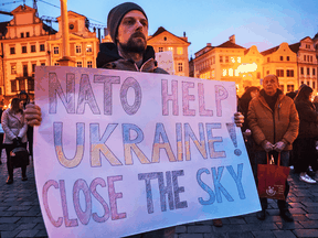 A protester calls for a no-fly zone over Ukraine during a rally in Prague on March 15, 2022.