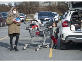 Mandy Alves with baby Isla and Nina, 3, after finishing grocery shopping in east Vancouver.